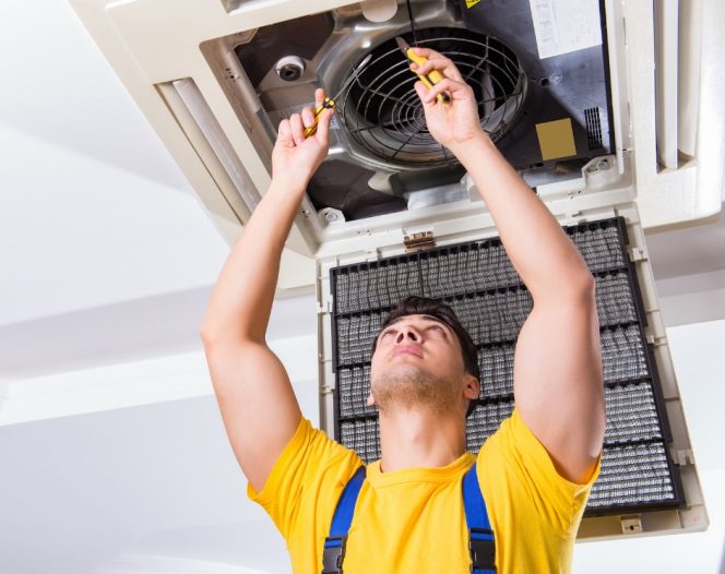 Technician performing HVAC services